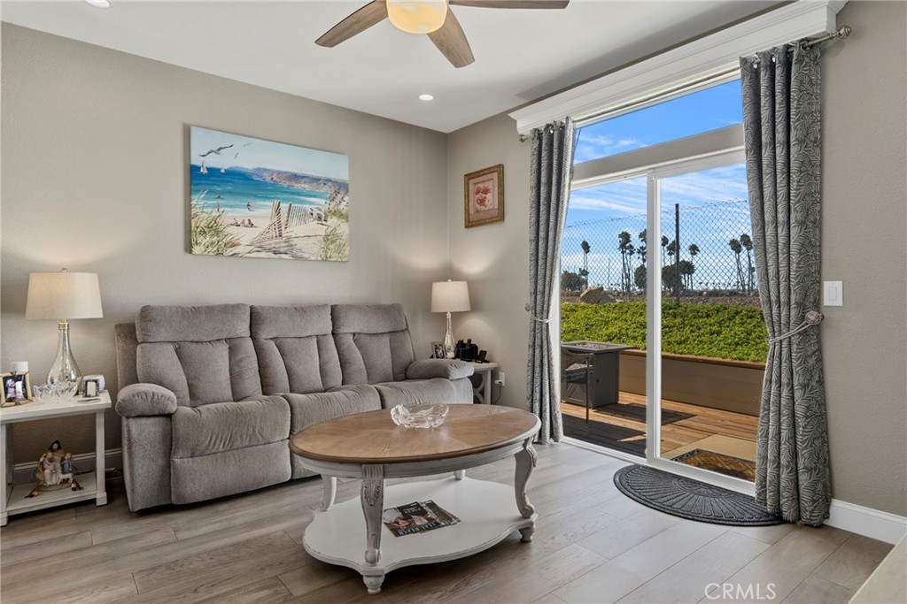 48 Riversea Road Seal Beach, CA 90740 - Photo 18 of 34 a living room with furniture and a gate