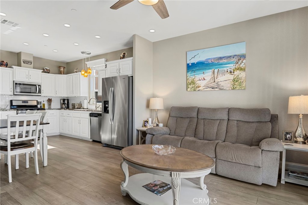 48 Riversea Road Seal Beach, CA 90740 - Photo 19 of 34 a living room with furniture and kitchen view