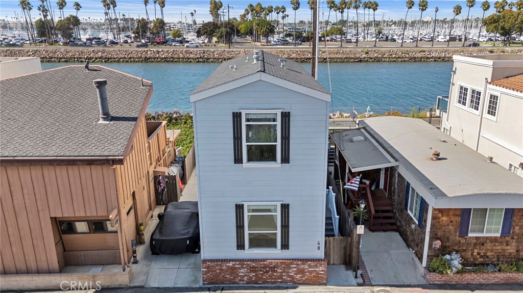 48 Riversea Road Seal Beach, CA 90740 - Photo 2 of 34 a aerial view of a house with a lake view