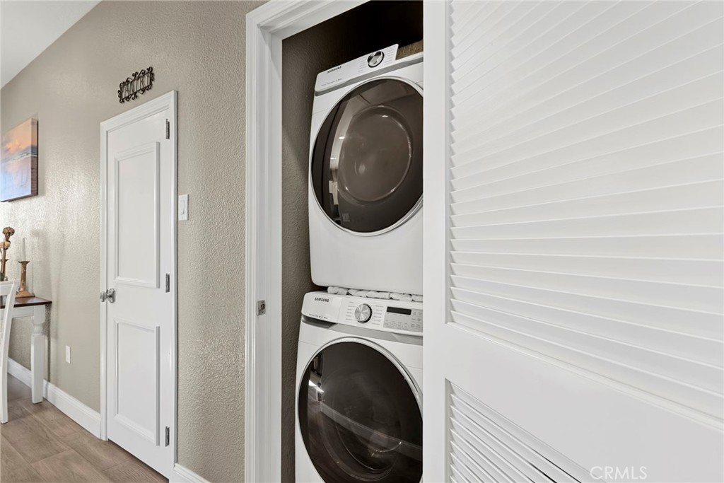 48 Riversea Road Seal Beach, CA 90740 - Photo 21 of 34 a view of a hallway with washer and dryer
