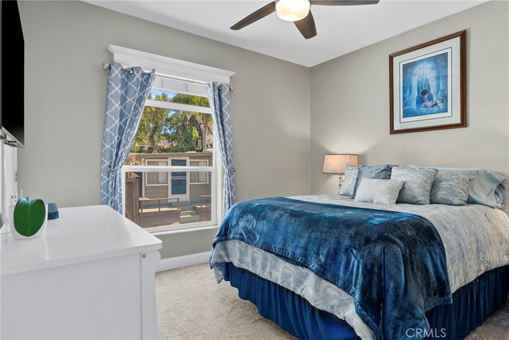 48 Riversea Road Seal Beach, CA 90740 - Photo 22 of 34 a bedroom with a bed and a window