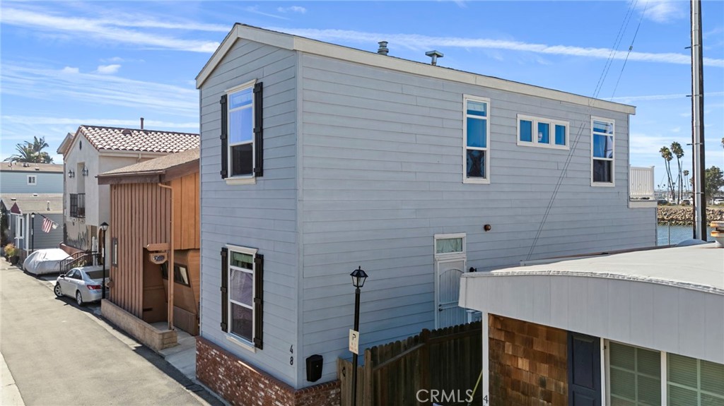 48 Riversea Road Seal Beach, CA 90740 - Photo 3 of 34 a bathroom with a sink and mirror