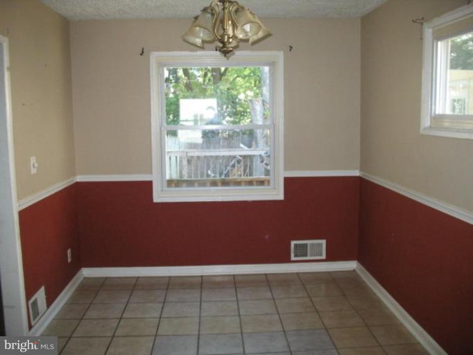 3510 Edwin Street Silver Spring, MD 20902 - Photo 8 of 8 an empty room with windows and outdoor view