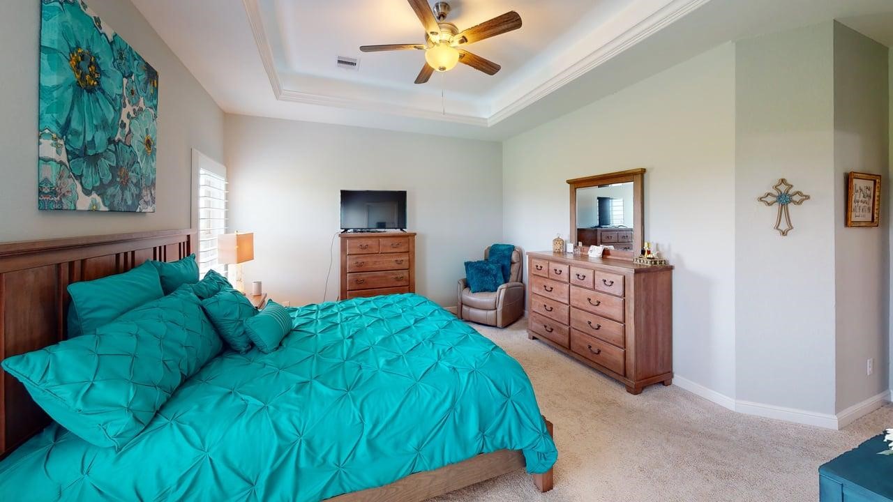 1325 Palomino Trail Angleton, TX 77515 - Photo 13 of 36 a bedroom with a bed dresser and a window