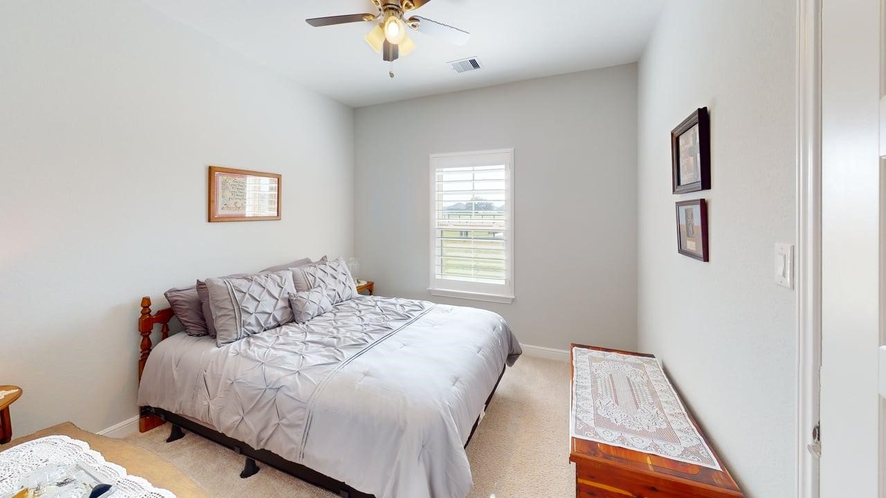 1325 Palomino Trail Angleton, TX 77515 - Photo 18 of 36 a bedroom with a bed and a window