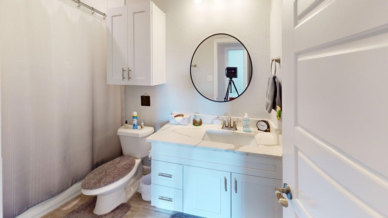 1325 Palomino Trail Angleton, TX 77515 - Photo 19 of 36 a bathroom with a sink and a mirror