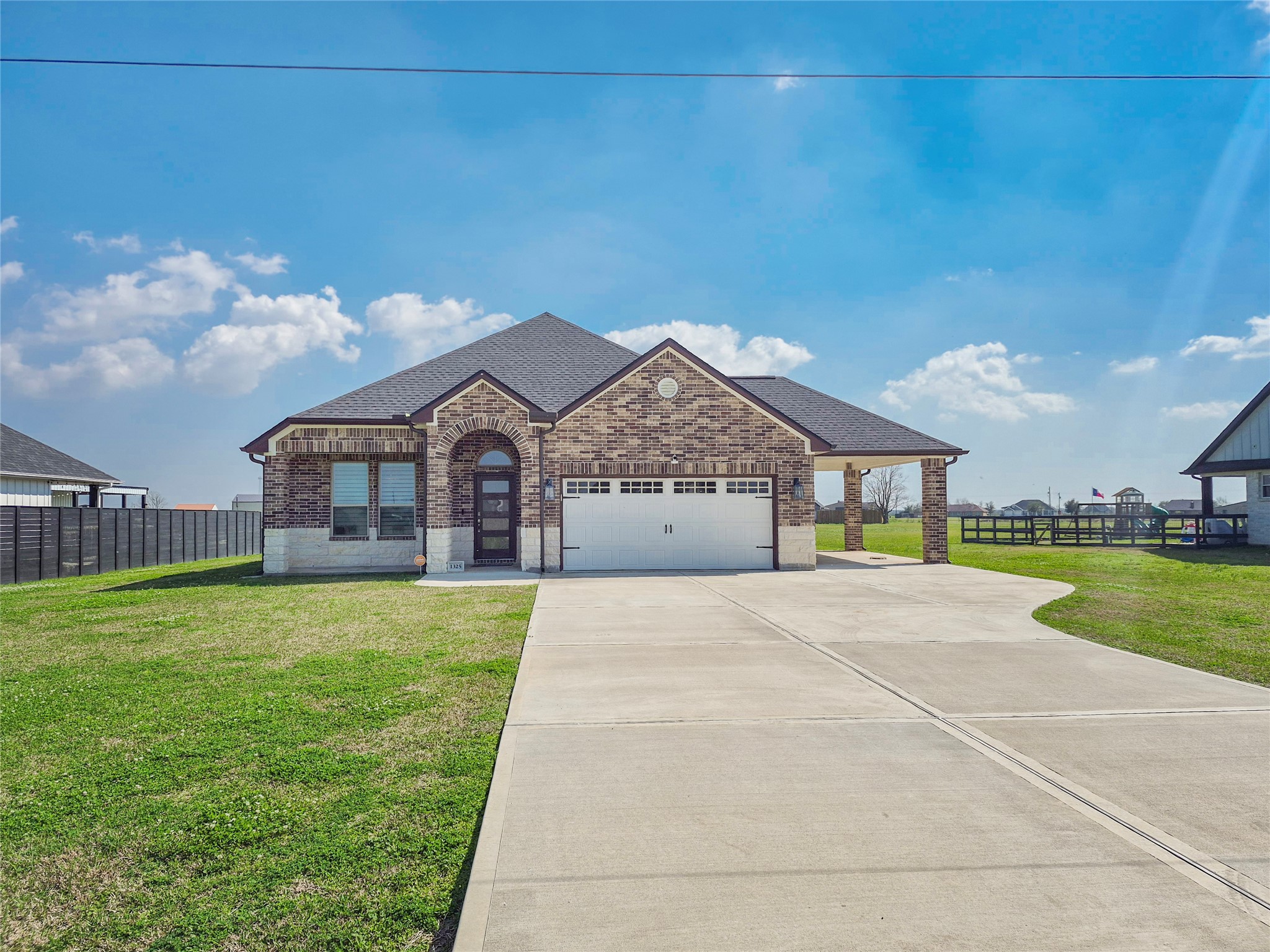 1325 Palomino Trail Angleton, TX 77515 - Photo 22 of 36 a front view of a house with a big yard