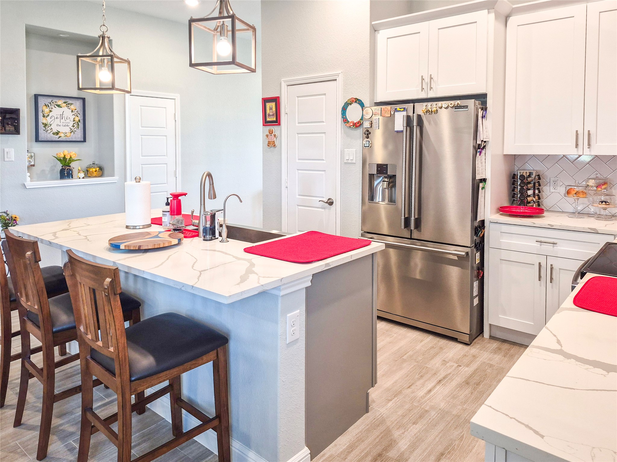 1325 Palomino Trail Angleton, TX 77515 - Photo 4 of 36 a kitchen with stainless steel appliances granite countertop a refrigerator and a stove