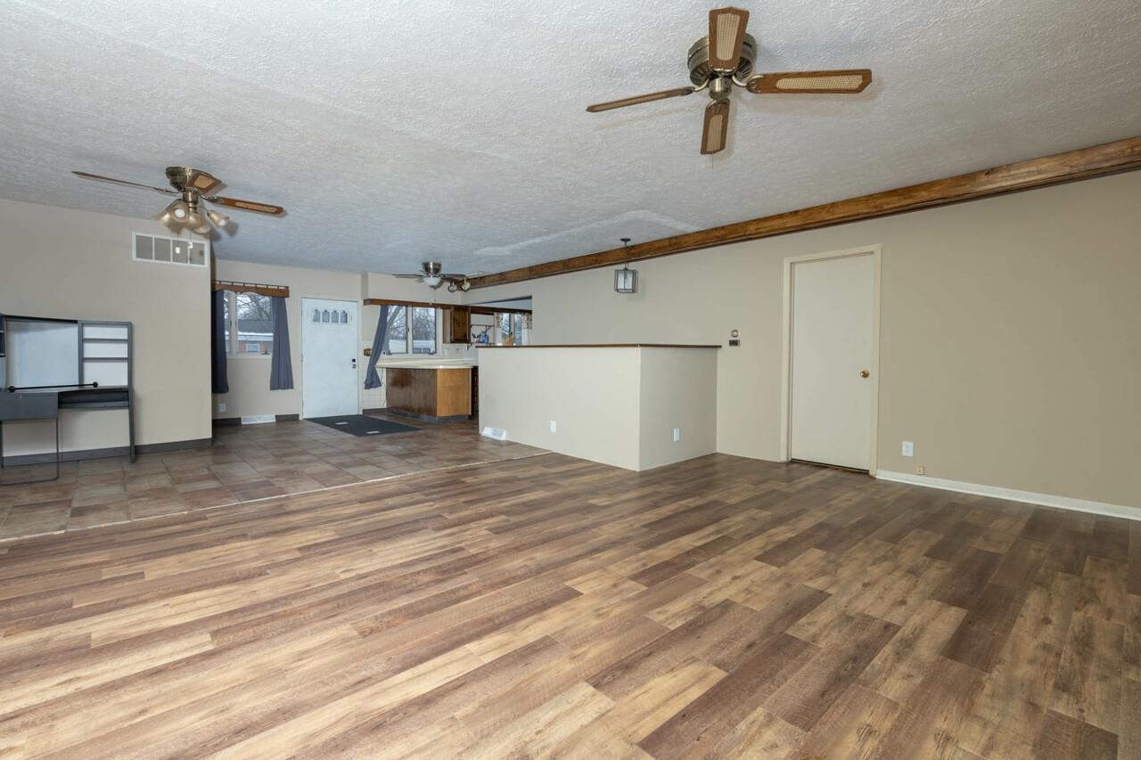 7401 Randy Road Machesney Park, IL 61115 - Photo 12 of 27 a view of a room with wooden floor and cabinet