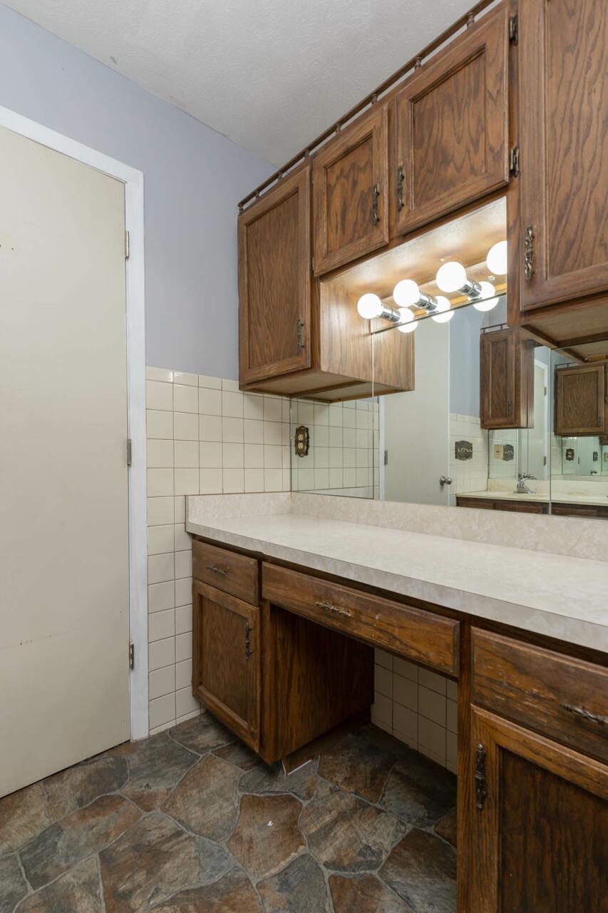 7401 Randy Road Machesney Park, IL 61115 - Photo 16 of 27 a bathroom with a sink and a mirror