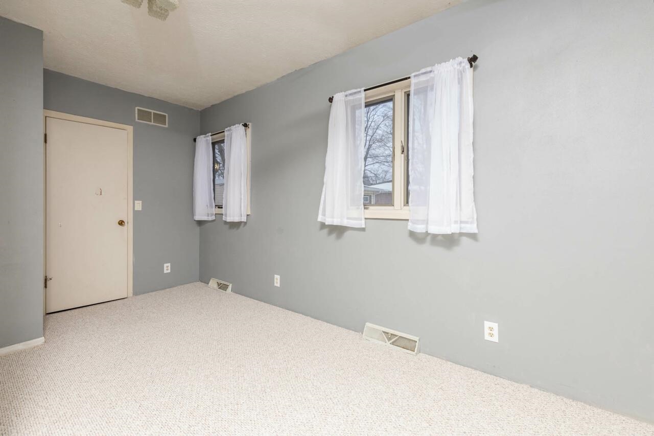7401 Randy Road Machesney Park, IL 61115 - Photo 21 of 27 a view of an empty room with a window