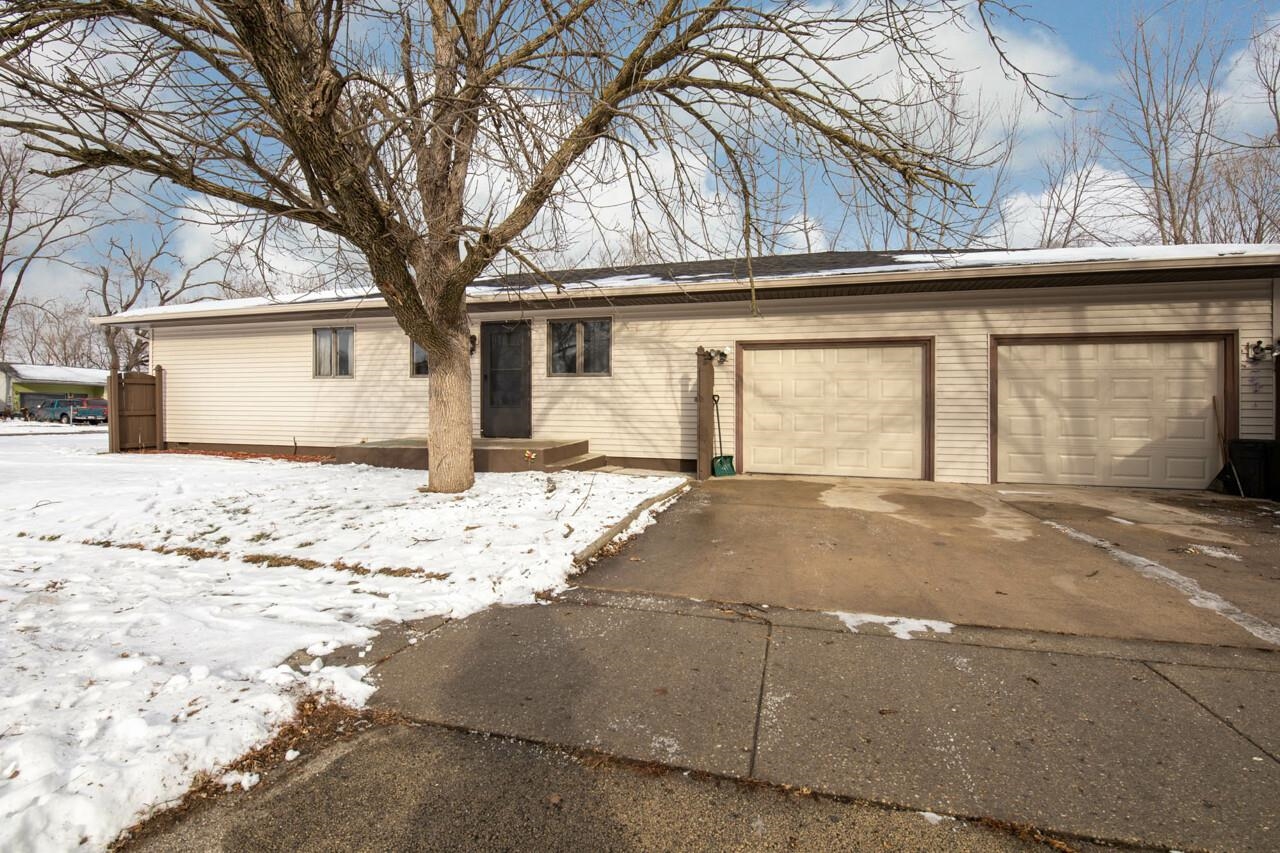 7401 Randy Road Machesney Park, IL 61115 - Photo 25 of 27 a front view of a house with a yard covered in snow