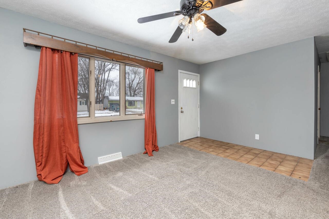 7401 Randy Road Machesney Park, IL 61115 - Photo 3 of 27 wooden floor and window in a room