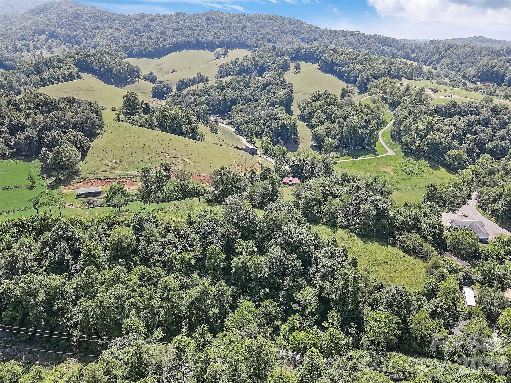1820 Grapevine Road Marshall, NC 28753 - Photo 15 of 48 an aerial view of mountain with residential house and green space