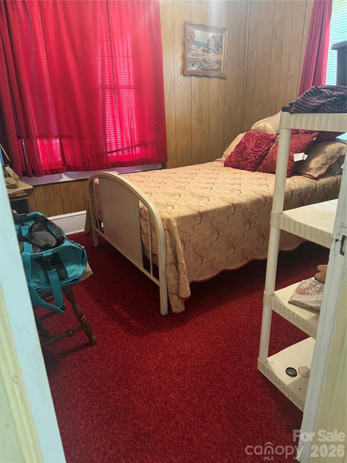 1820 Grapevine Road Marshall, NC 28753 - Photo 45 of 48 a bed sitting in a bedroom next to a window