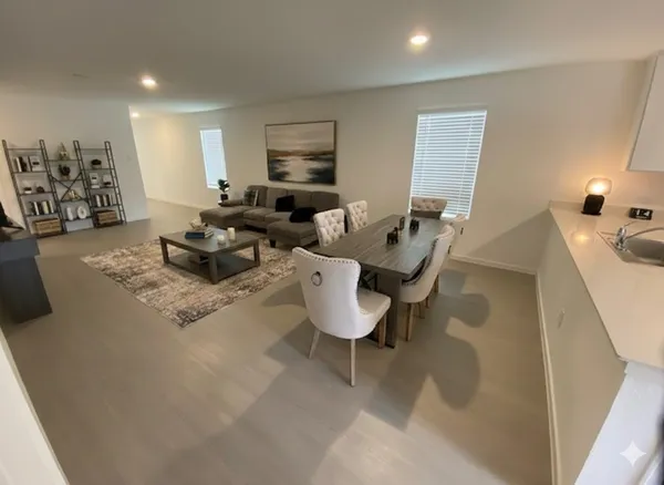a living room with furniture window and a table