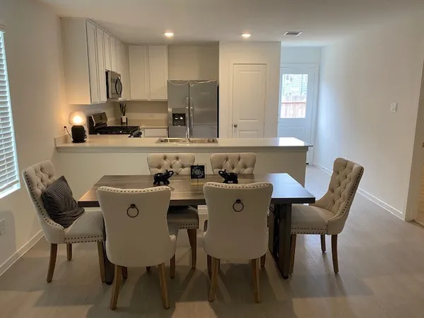 a view of a dining room with furniture