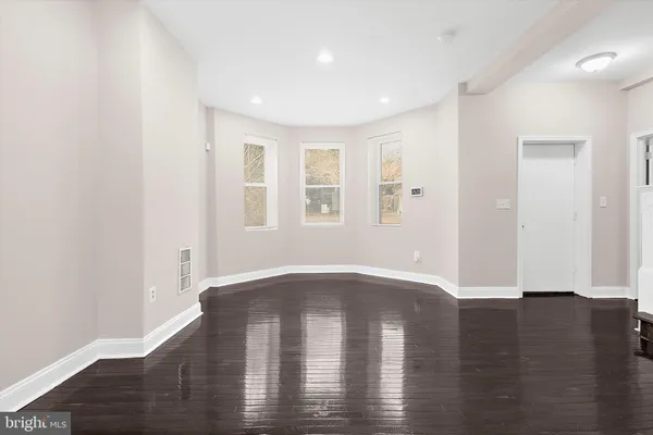 a kitchen with stainless steel appliances a stove top oven and refrigerator