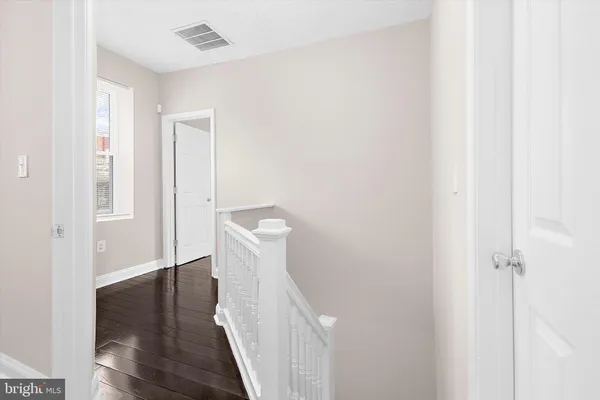 a view of walk in closet with clothes
