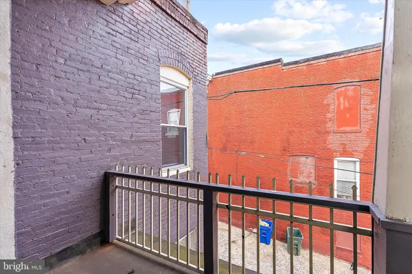 a view of a balcony with a pot