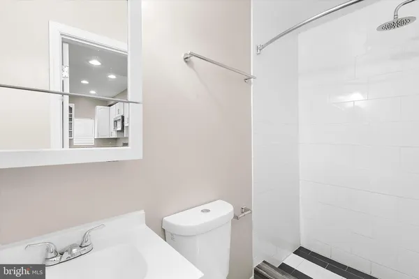 a view of a refrigerator in kitchen and wooden floor