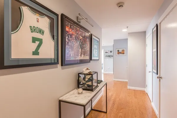 a view of a hallway with seating area