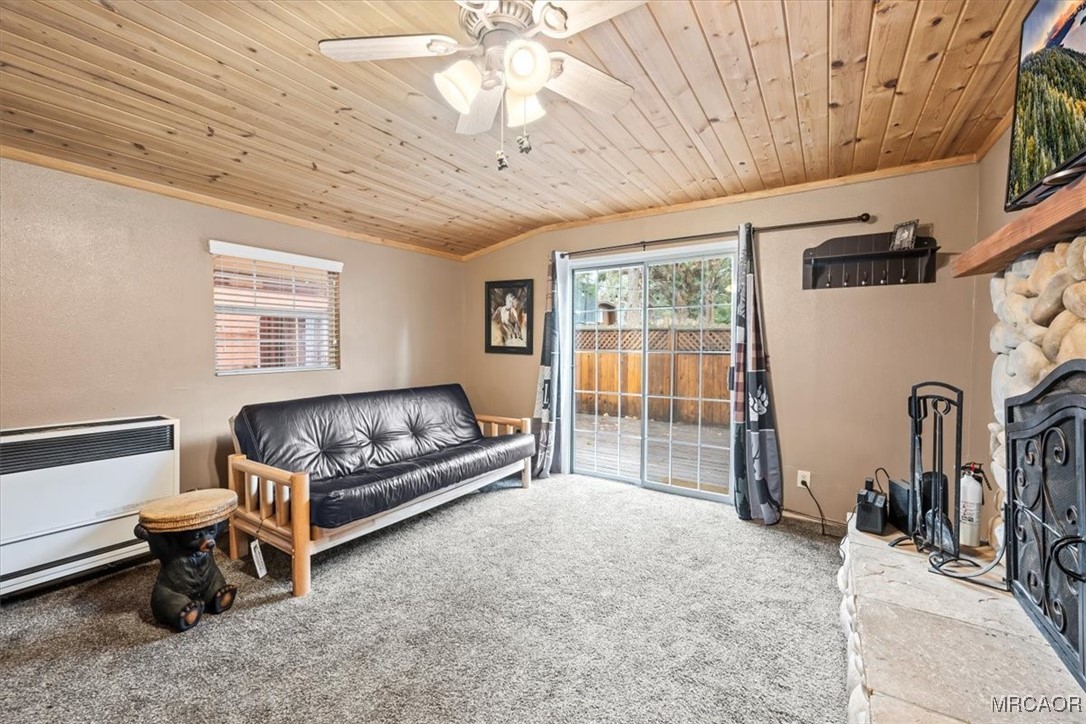 44361 Silver Pine Road Sugarloaf, CA 92386 - Photo 11 of 20 a living room with furniture a flat screen tv and a table