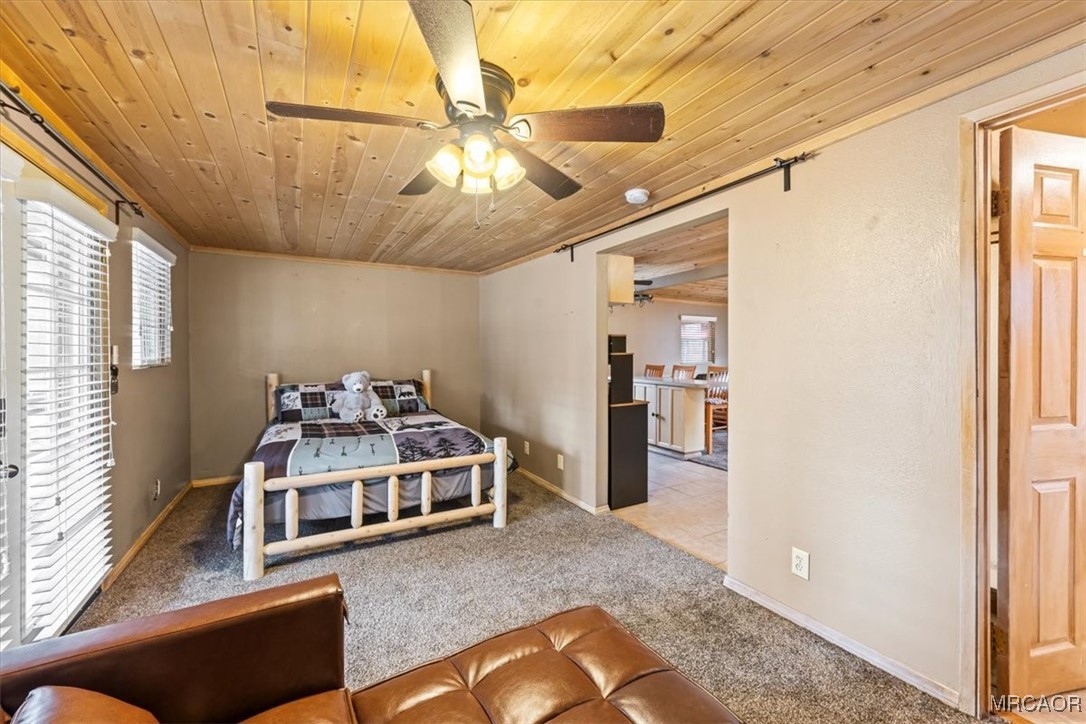 44361 Silver Pine Road Sugarloaf, CA 92386 - Photo 15 of 20 a living room with furniture and a chandelier