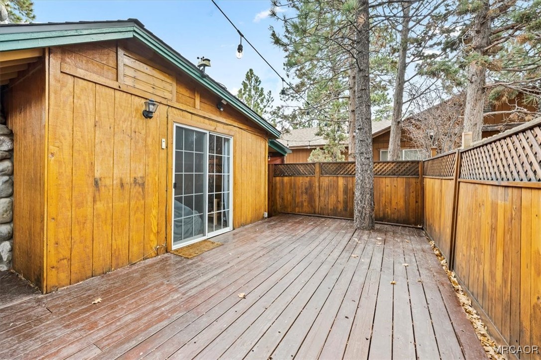 44361 Silver Pine Road Sugarloaf, CA 92386 - Photo 18 of 20 a view of a house with wooden floor and a yard