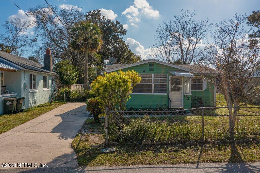 60 Jackson Road Atlantic Beach, FL 32233 - Photo 2 of 42 a front view of a house with garden