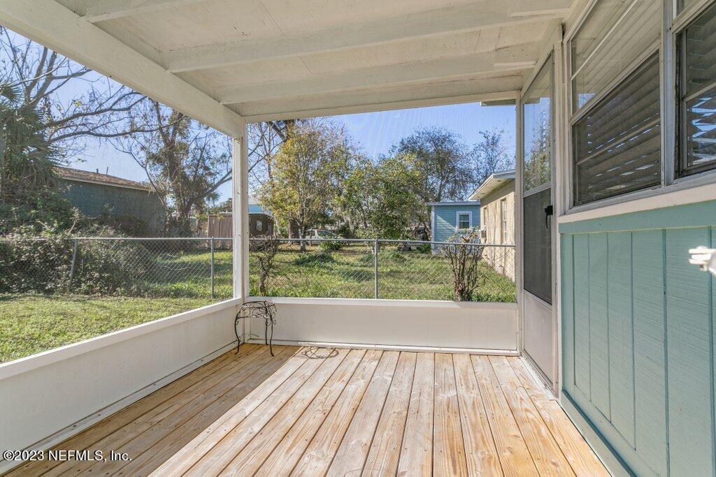 60 Jackson Road Atlantic Beach, FL 32233 - Photo 28 of 42 a view of a room with wooden floor and iron stairs