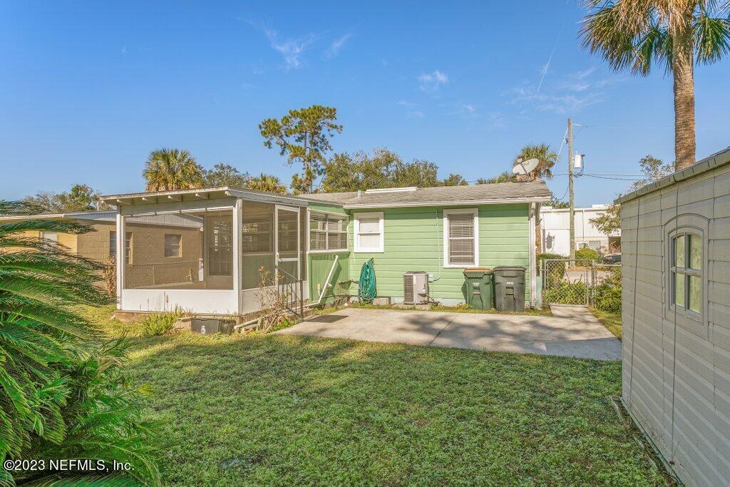 60 Jackson Road Atlantic Beach, FL 32233 - Photo 30 of 42 a front view of a house with a yard table and chairs