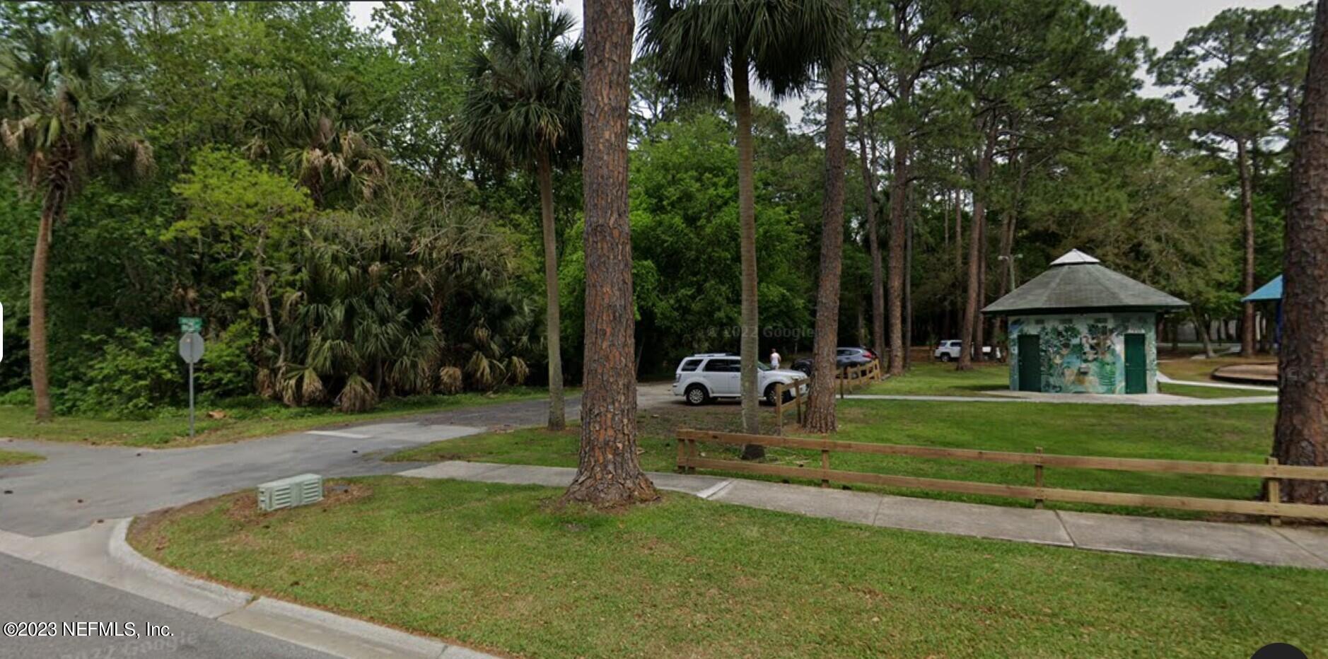 60 Jackson Road Atlantic Beach, FL 32233 - Photo 41 of 42 a view of a park with large trees and a yard