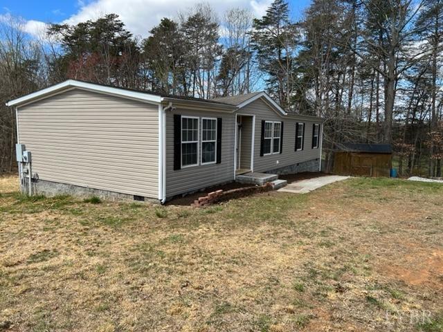327 Rhodies Road Prospect, VA 23960 - Photo 17 of 18 a view of a house with a yard