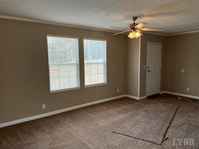 327 Rhodies Road Prospect, VA 23960 - Photo 7 of 18 an empty room with chandelier fan and windows
