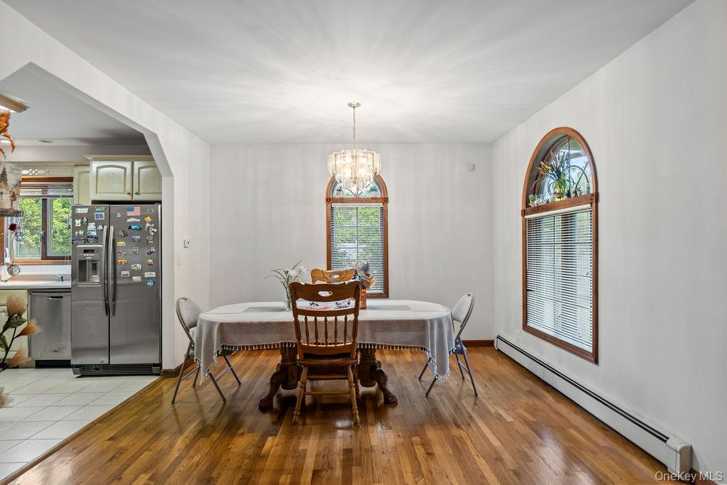 289 Seven Springs Mountain Road Monroe, NY 10950 - Photo 6 of 25 a view of a dining room with furniture window and wooden floor