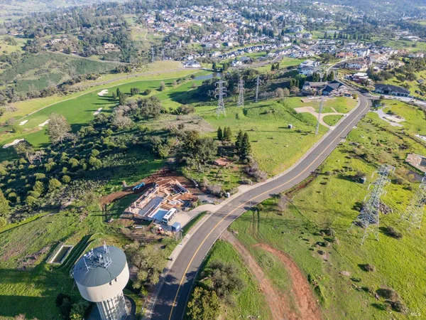a view of a swimming pool with a yard