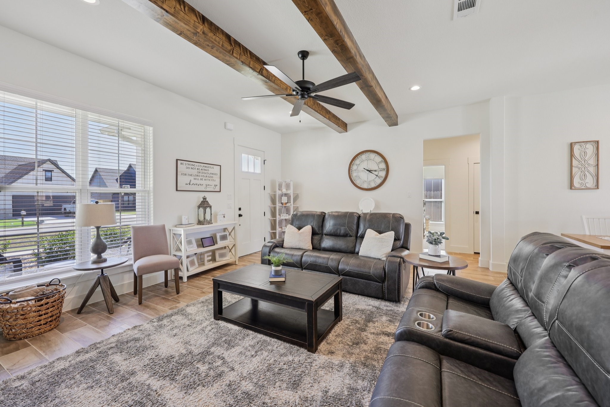 2032 Rattler Way Tolar, TX 76476 - Photo 12 of 49 a living room with furniture and a clock