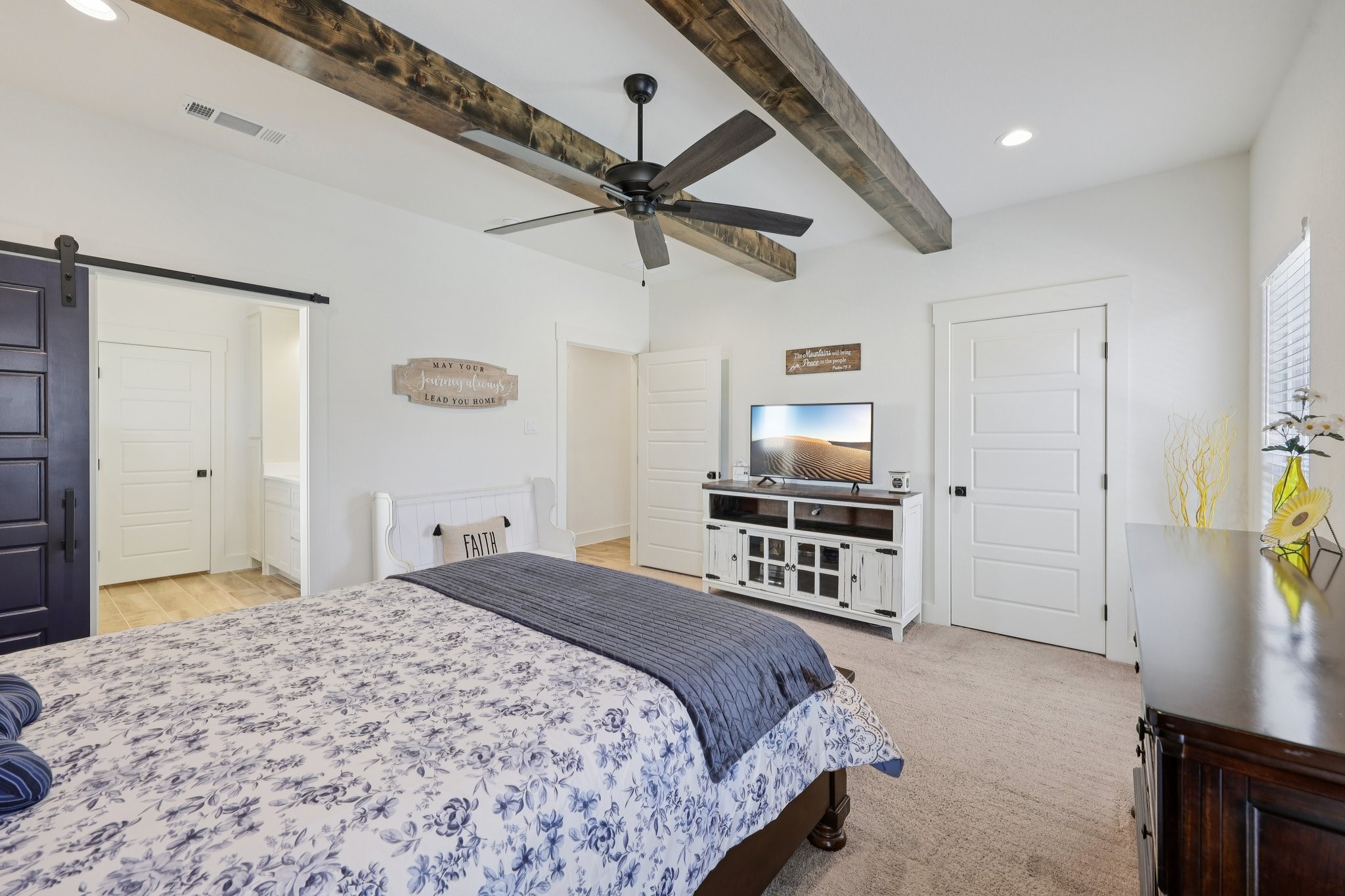 2032 Rattler Way Tolar, TX 76476 - Photo 20 of 49 a bedroom with a bed and a flat screen tv