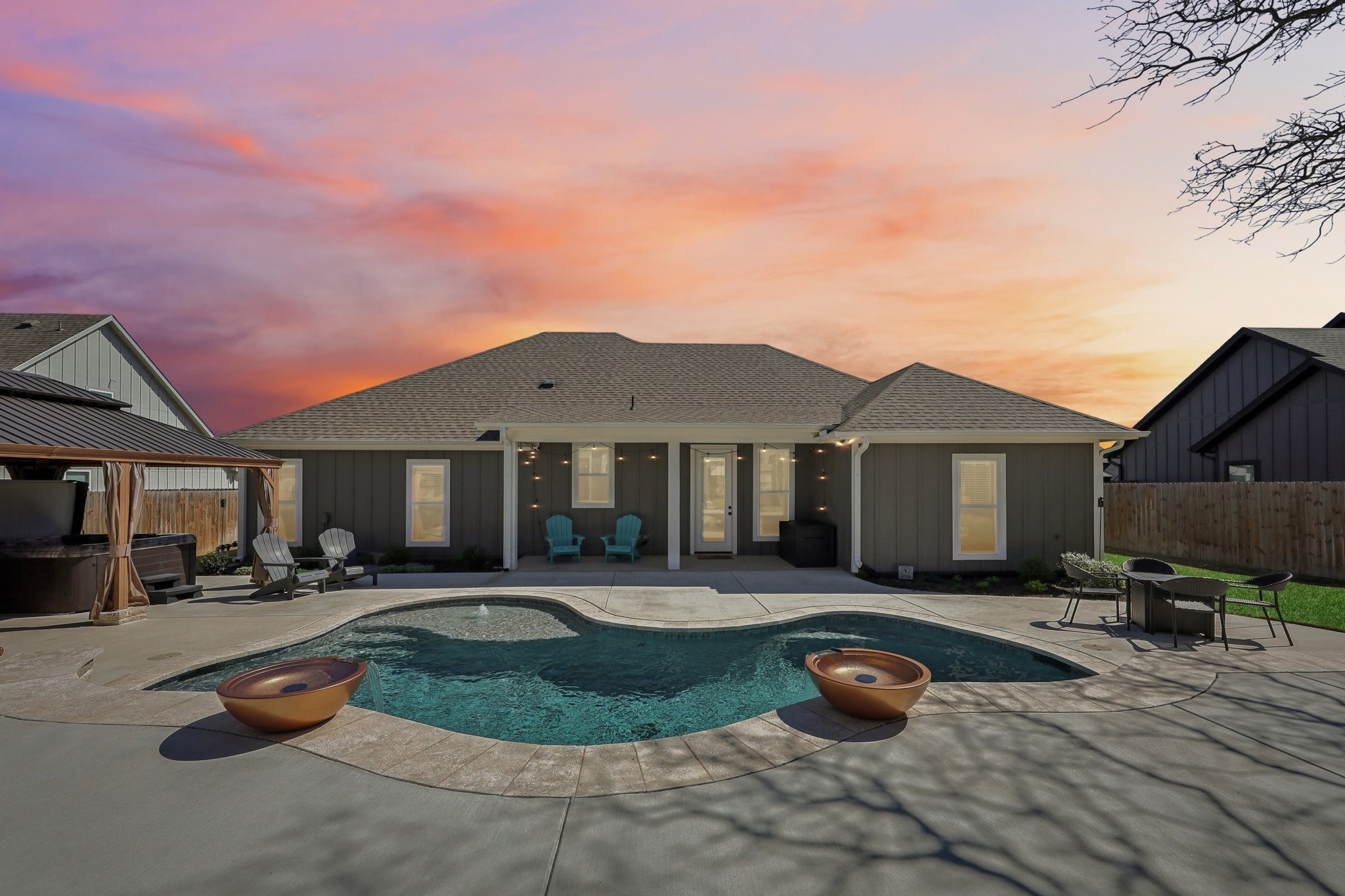 2032 Rattler Way Tolar, TX 76476 - Photo 2 of 49 a front view of a house with swimming pool and sitting area