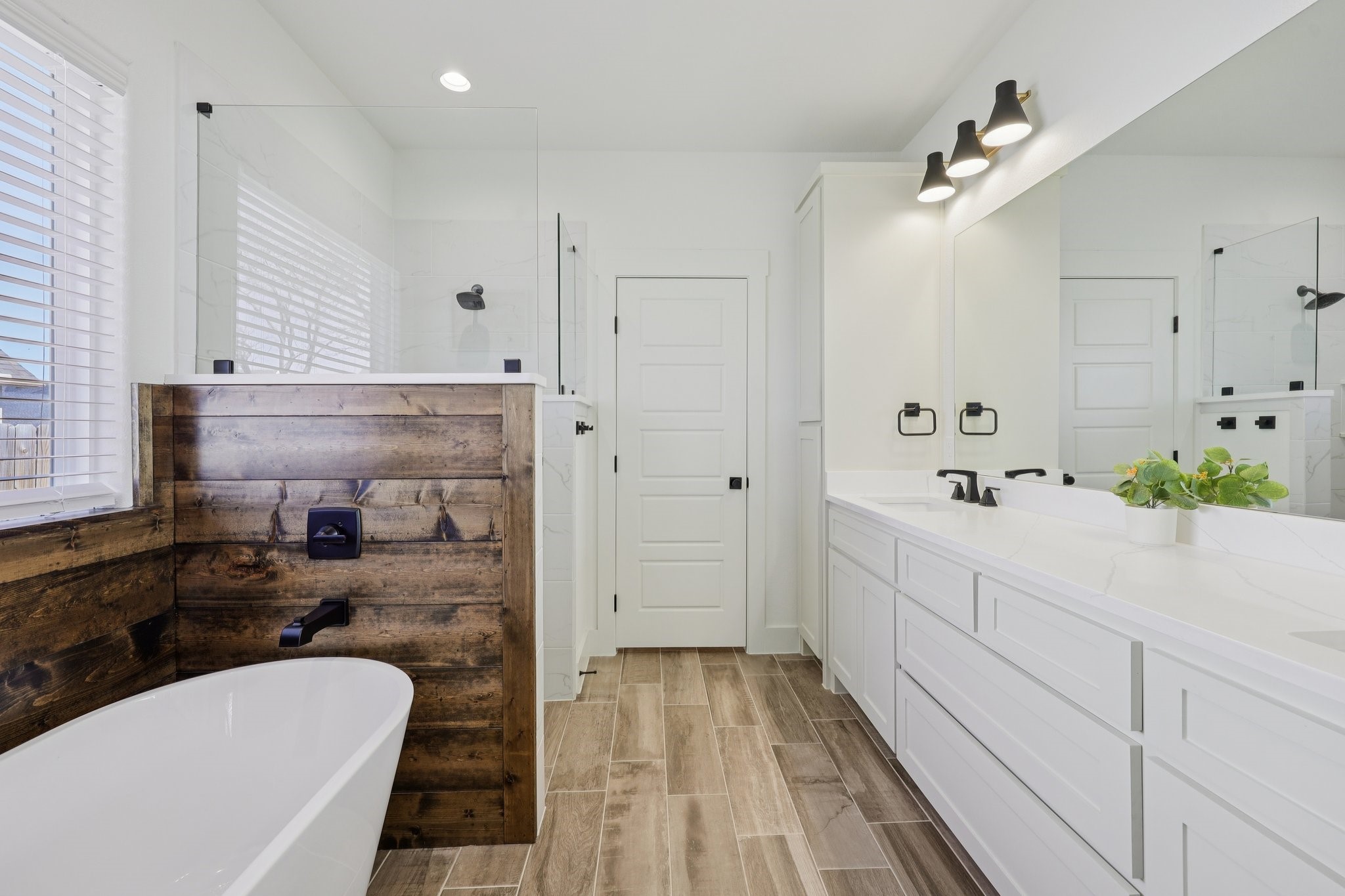 2032 Rattler Way Tolar, TX 76476 - Photo 22 of 49 a bathroom with a tub sink and mirror