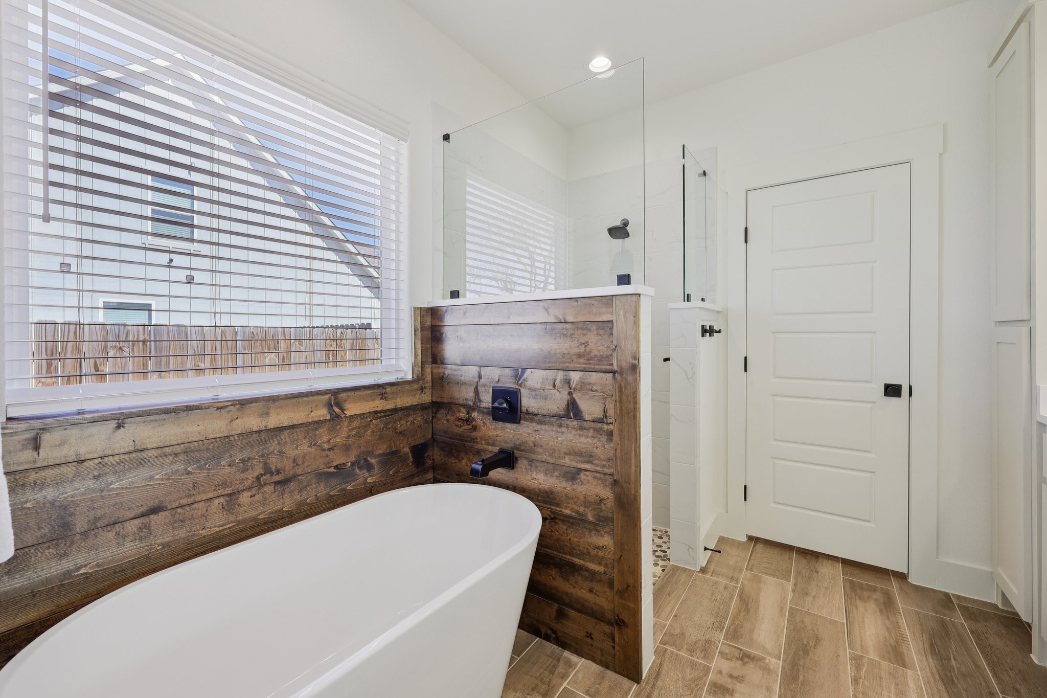 2032 Rattler Way Tolar, TX 76476 - Photo 23 of 49 a bathroom with a tub and a sink