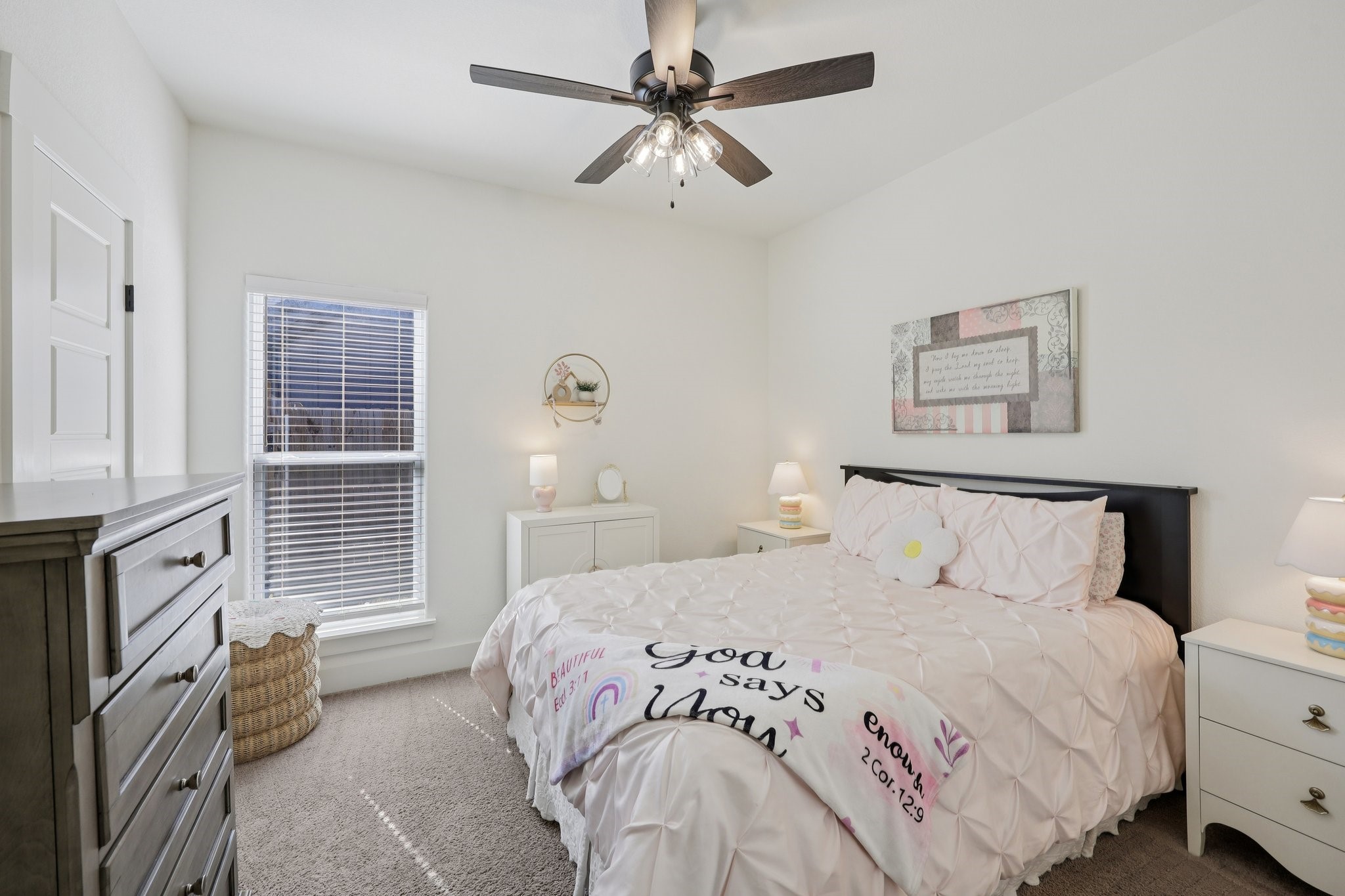 2032 Rattler Way Tolar, TX 76476 - Photo 26 of 49 a bedroom with a bed and a chandelier