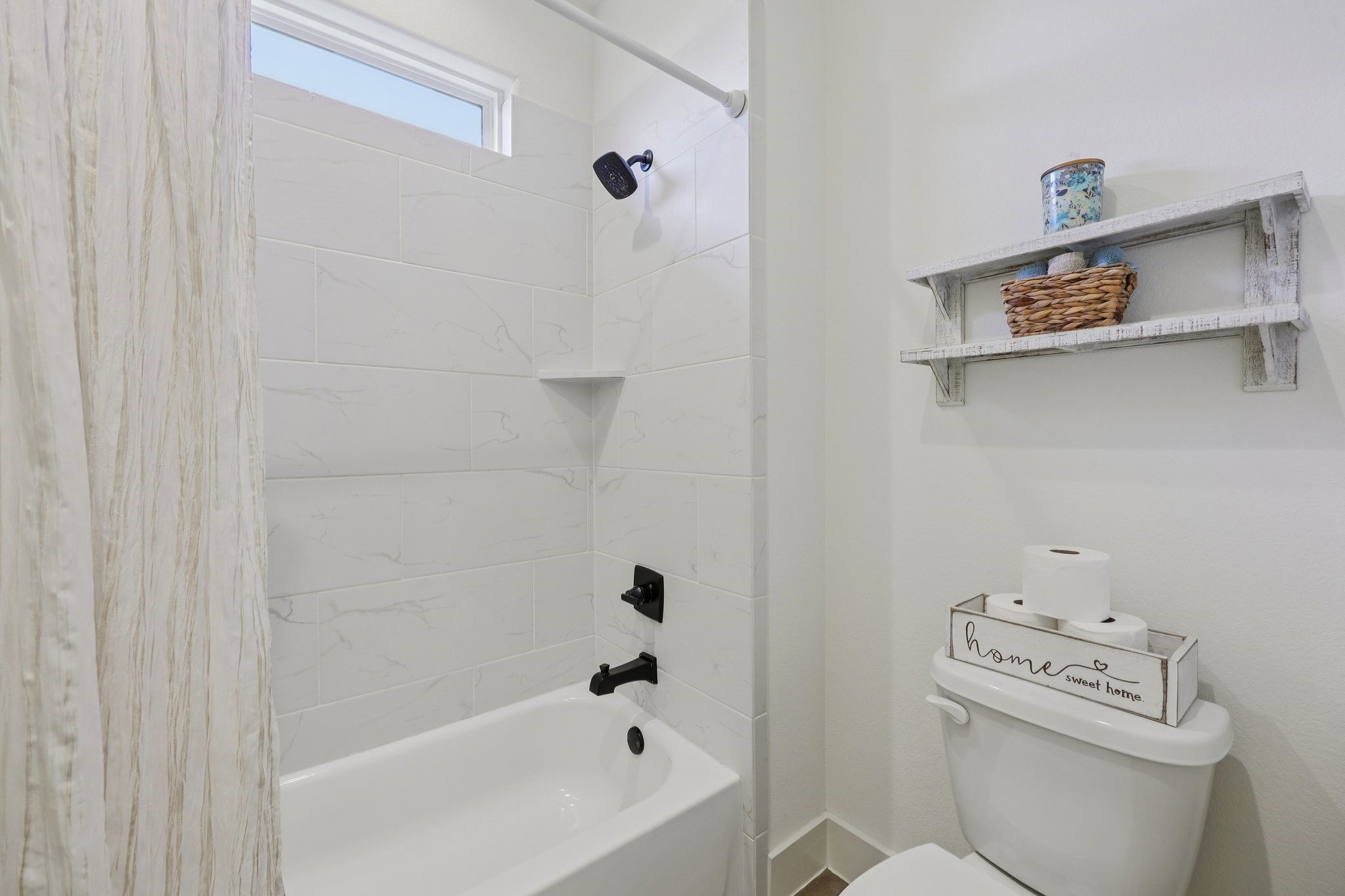 2032 Rattler Way Tolar, TX 76476 - Photo 30 of 49 a bathroom with a bathtub and a toilet