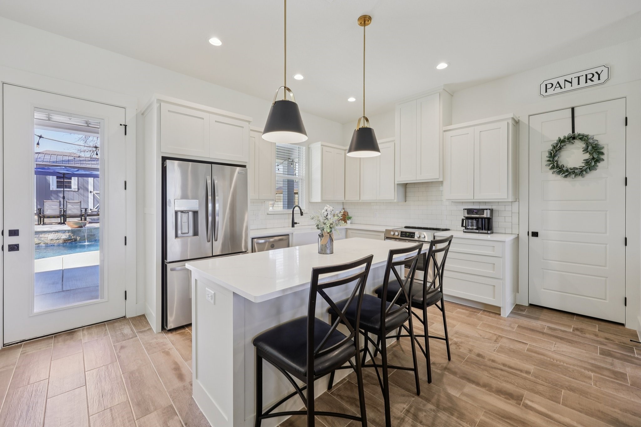 2032 Rattler Way Tolar, TX 76476 - Photo 3 of 49 a large kitchen with a table and chairs