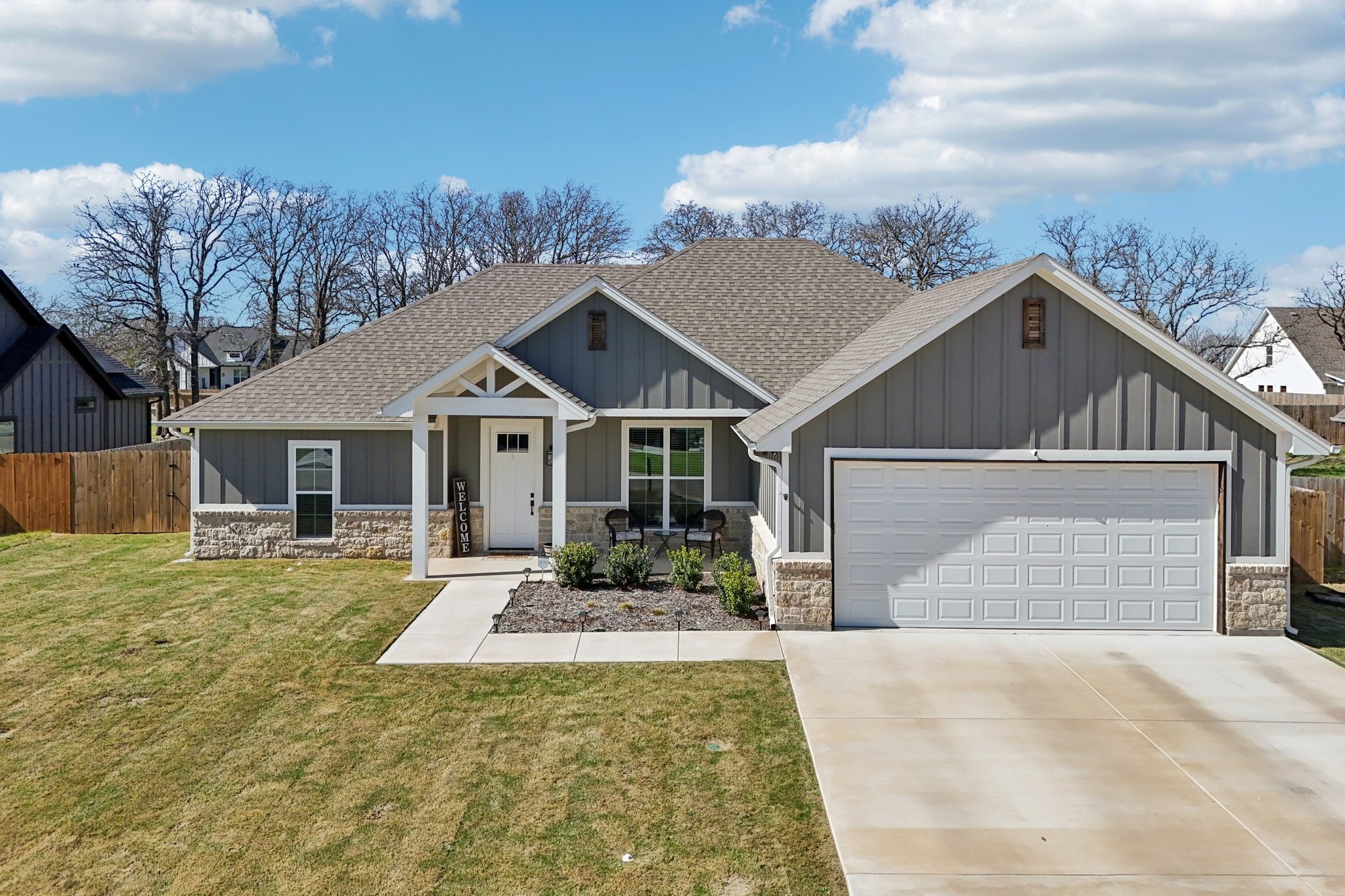2032 Rattler Way Tolar, TX 76476 - Photo 41 of 49 a front view of a house with a yard and garage