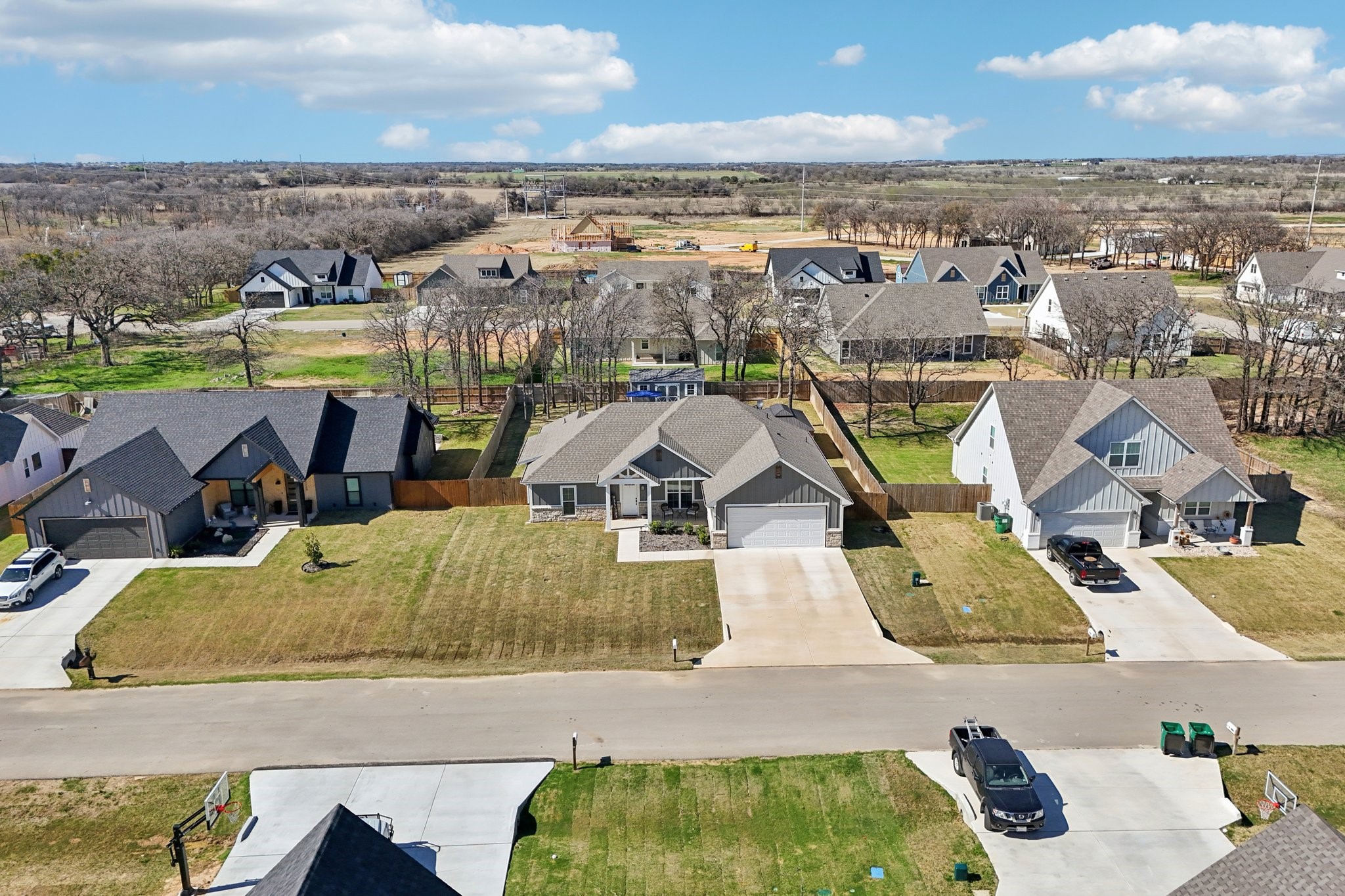 2032 Rattler Way Tolar, TX 76476 - Photo 44 of 49 an aerial view of a house with a swimming pool