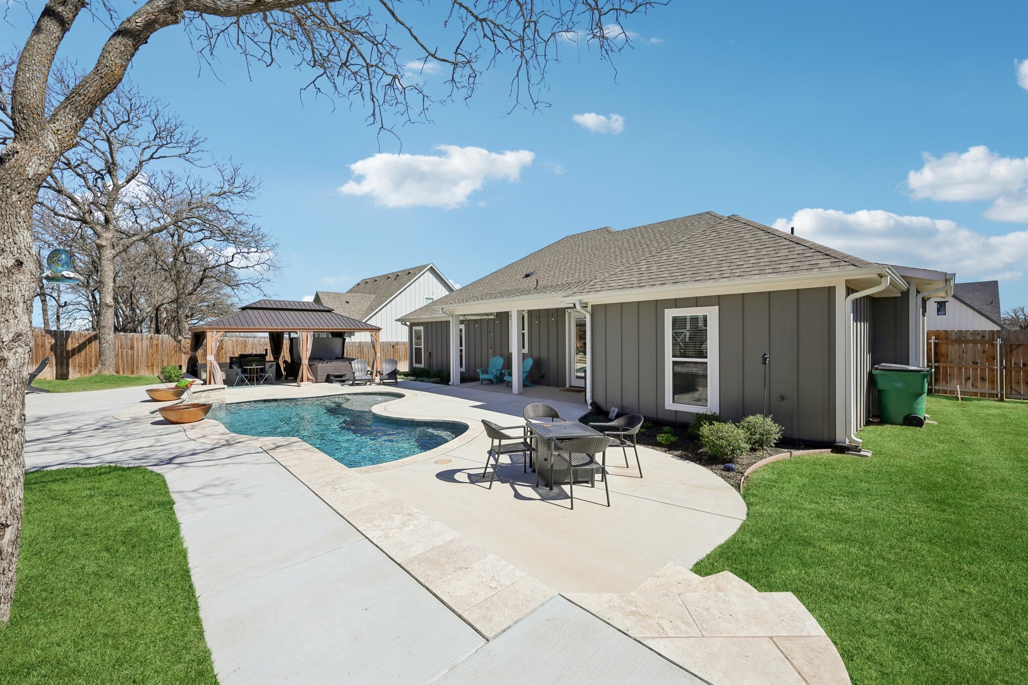 2032 Rattler Way Tolar, TX 76476 - Photo 6 of 49 a view of a house with a yard patio and fire pit