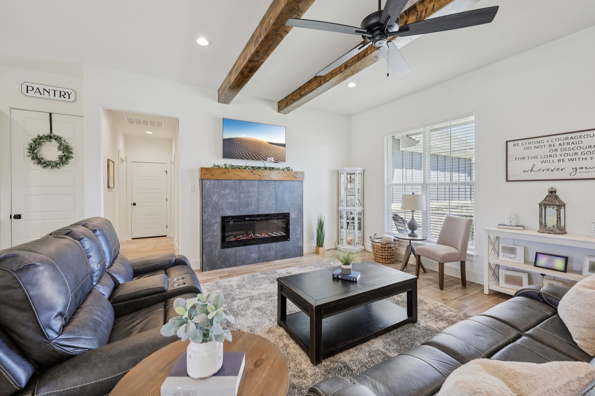 2032 Rattler Way Tolar, TX 76476 - Photo 10 of 49 a living room with furniture fireplace and window