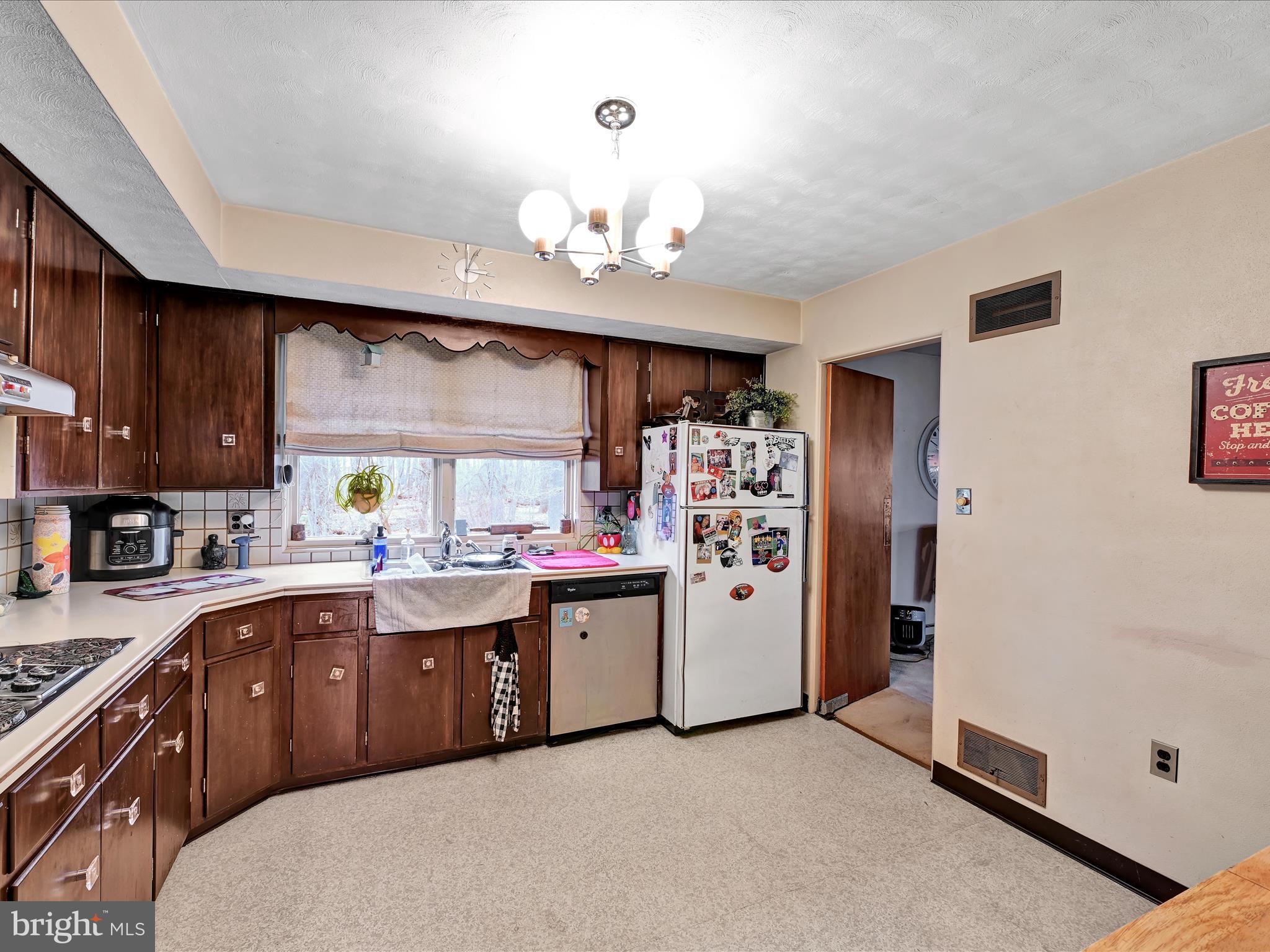 1181 Knights View Road Wrightsville, PA 17368 - Photo 14 of 40 a kitchen with stainless steel appliances a sink a stove and refrigerator